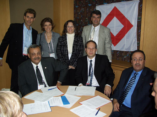 Seoul, Korea 2005. At the signing ceremony: Uri Geller, Anna Segall, Federation Representative in Israel. Yael Ronen, International Legal Advisor. Moshico Elbaz, Member of the Board, Magen David Adom Younis Al-Khatib, President Palestine Red Crescent Society. Dr. Noam Yifrach, President, Magen David Adom. Dr. Mohammed Al-Hadid, Chairman, Standing Commissioner of the Red Cross and Red Crescent.