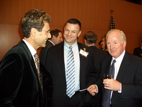 Geneva, Switzerland 2005. US Ambassador Kevin E. Moley and Lieutenant Colonel United States Marine Corps David Gurfein having a conversation with Uri Geller.